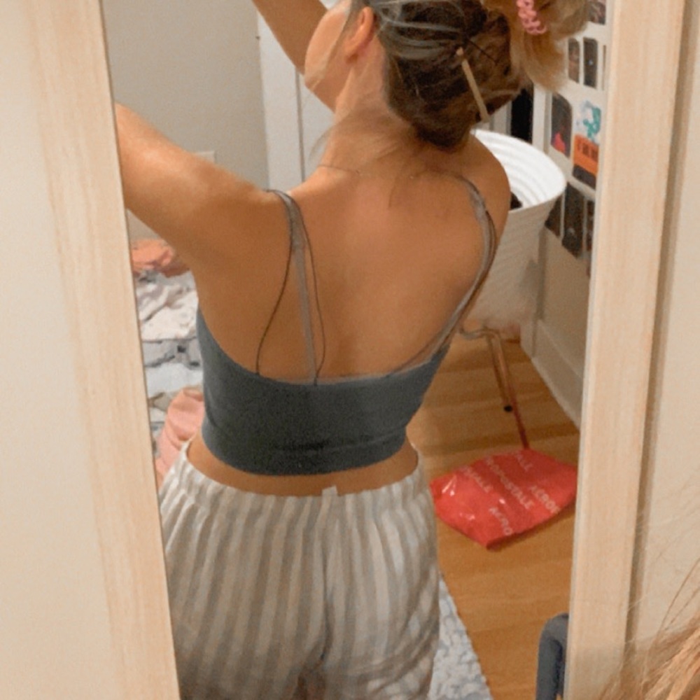 Green ish tank with 2 straps.